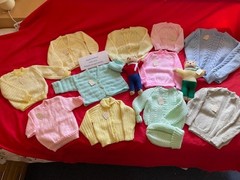 Job lot of NEW hand knitted jumpers and cardigans.