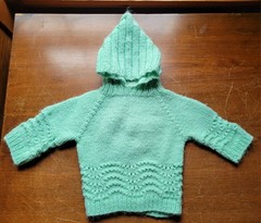 handmade light green knitted baby sweater with a hood-zipper In Back