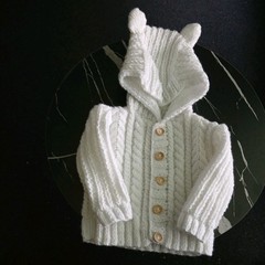 Elaborately Cabled Baby’s Hooded Jacket Hand Knitted In White Acrylic DK Wool