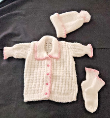 Beautifully handmade, white &pink knitted layette set for an infant 6-9 Mos