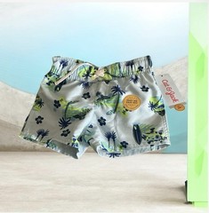 Light blue swim shorts with tropical print and elastic waist